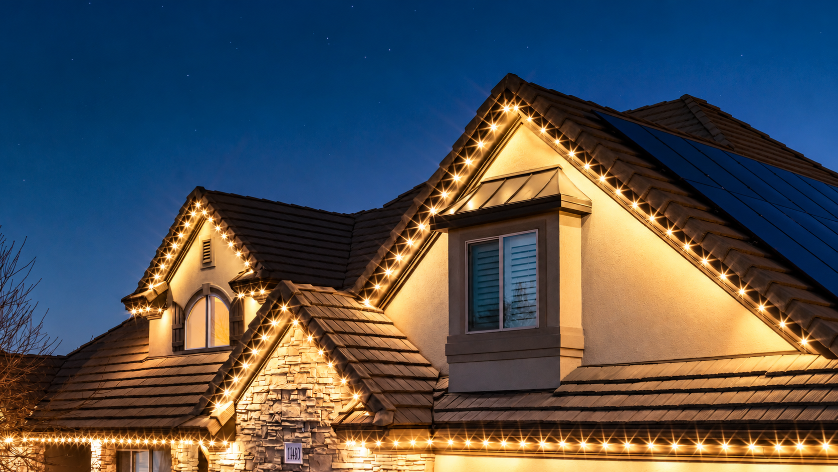 Trimlight permanent lights in warm white, shown on an example home