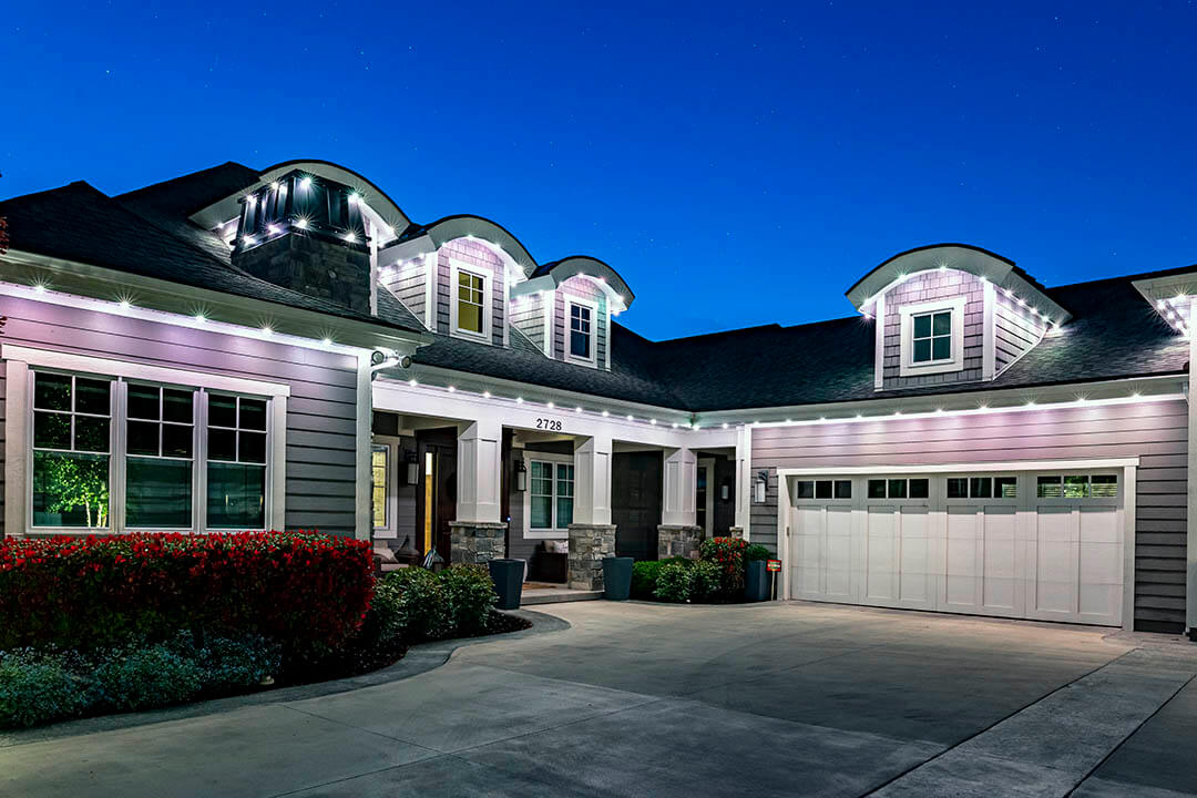 Home lit with outdoor lighting at night